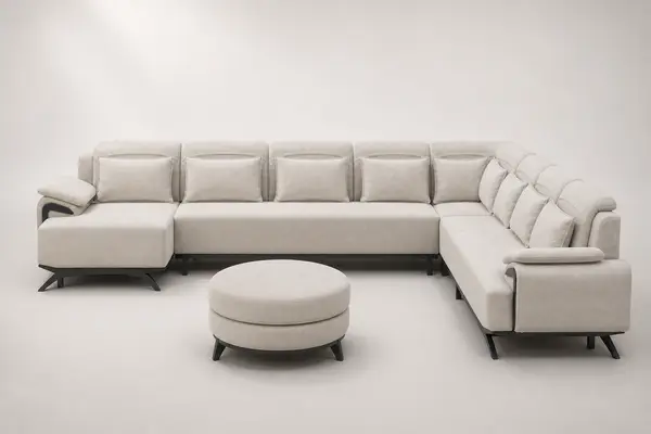 Cream channel-tufted U-sectional with round ottoman, front view