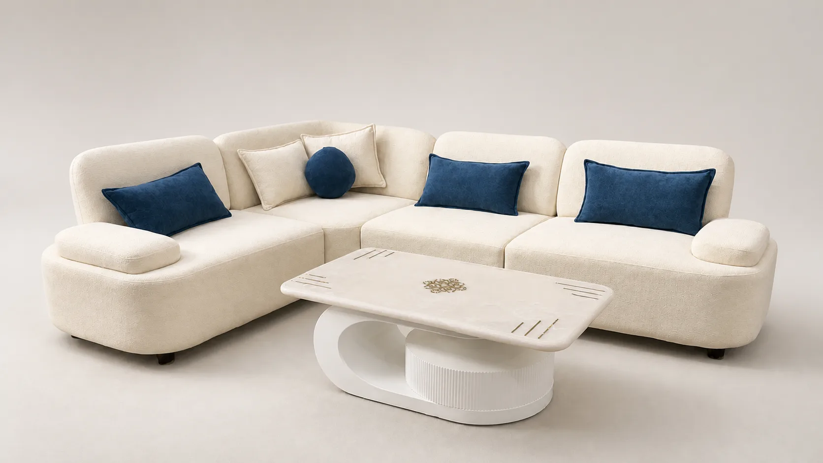 Cream boucle sofa with navy blue accent cushions and marble pedestal table.