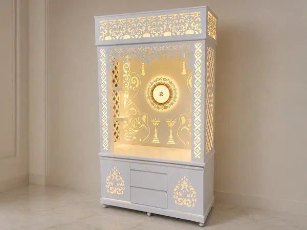 Tall mandir with Om wheel styled in a home pooja corner