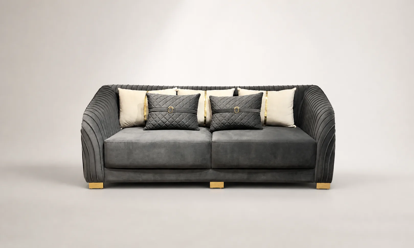 Charcoal velvet pleated-arm loveseat in a styled living room
