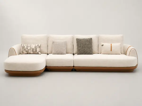 Cream boucle L-sofa with tan leather trim, front view