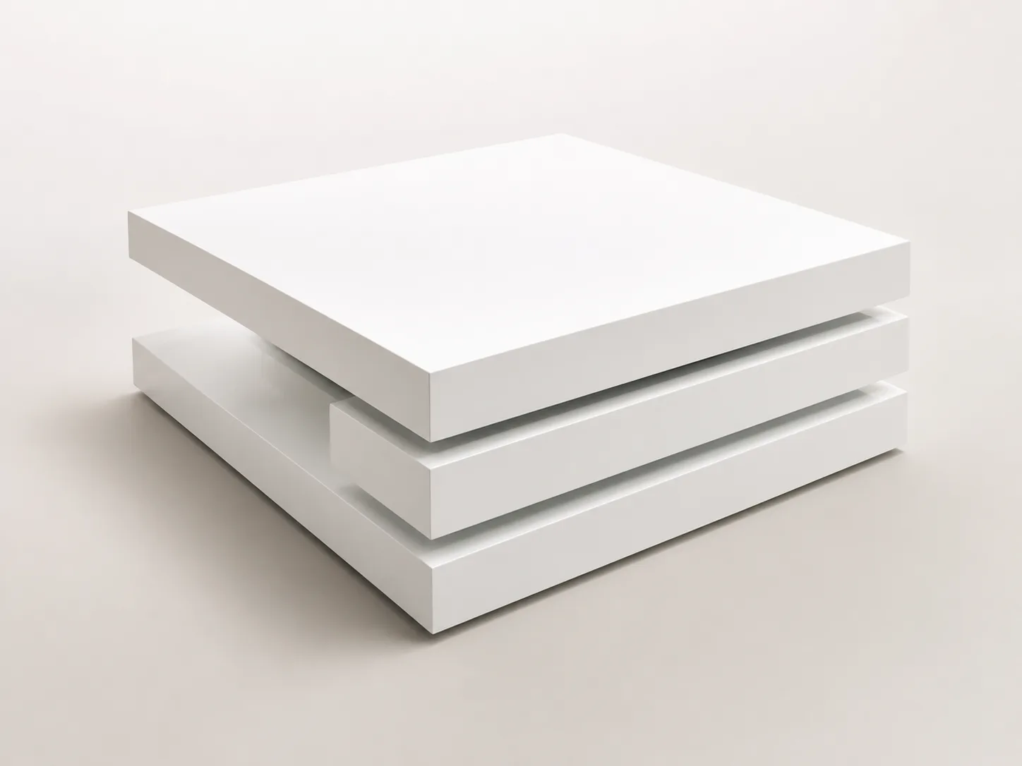 White lacquer swivel center table with layered rotating tiers.