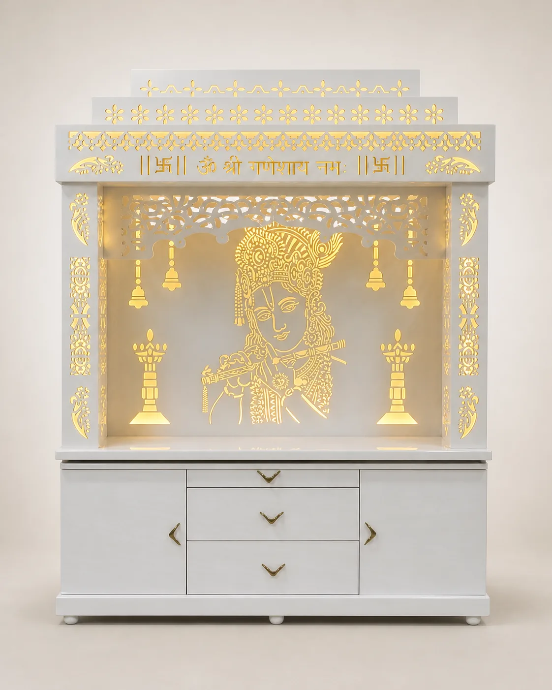 White mandir unit with backlit Radha-Krishna lattice panel, carved temple bells and jaali side panels.